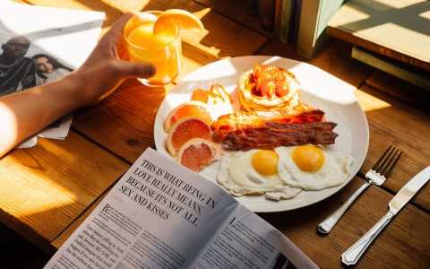 a breakfast plate and newspaper