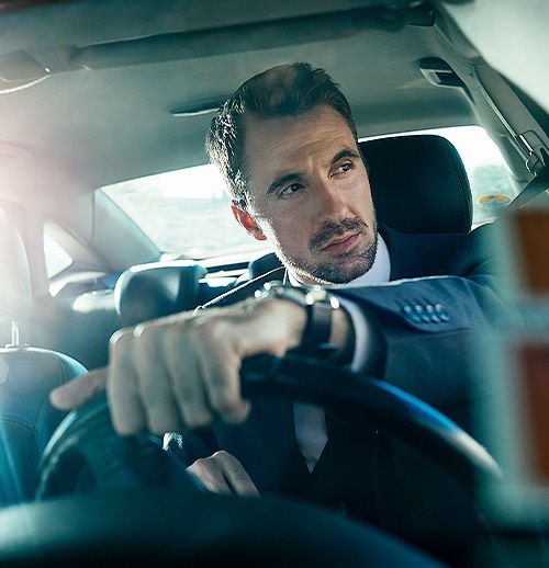 a man driving a car